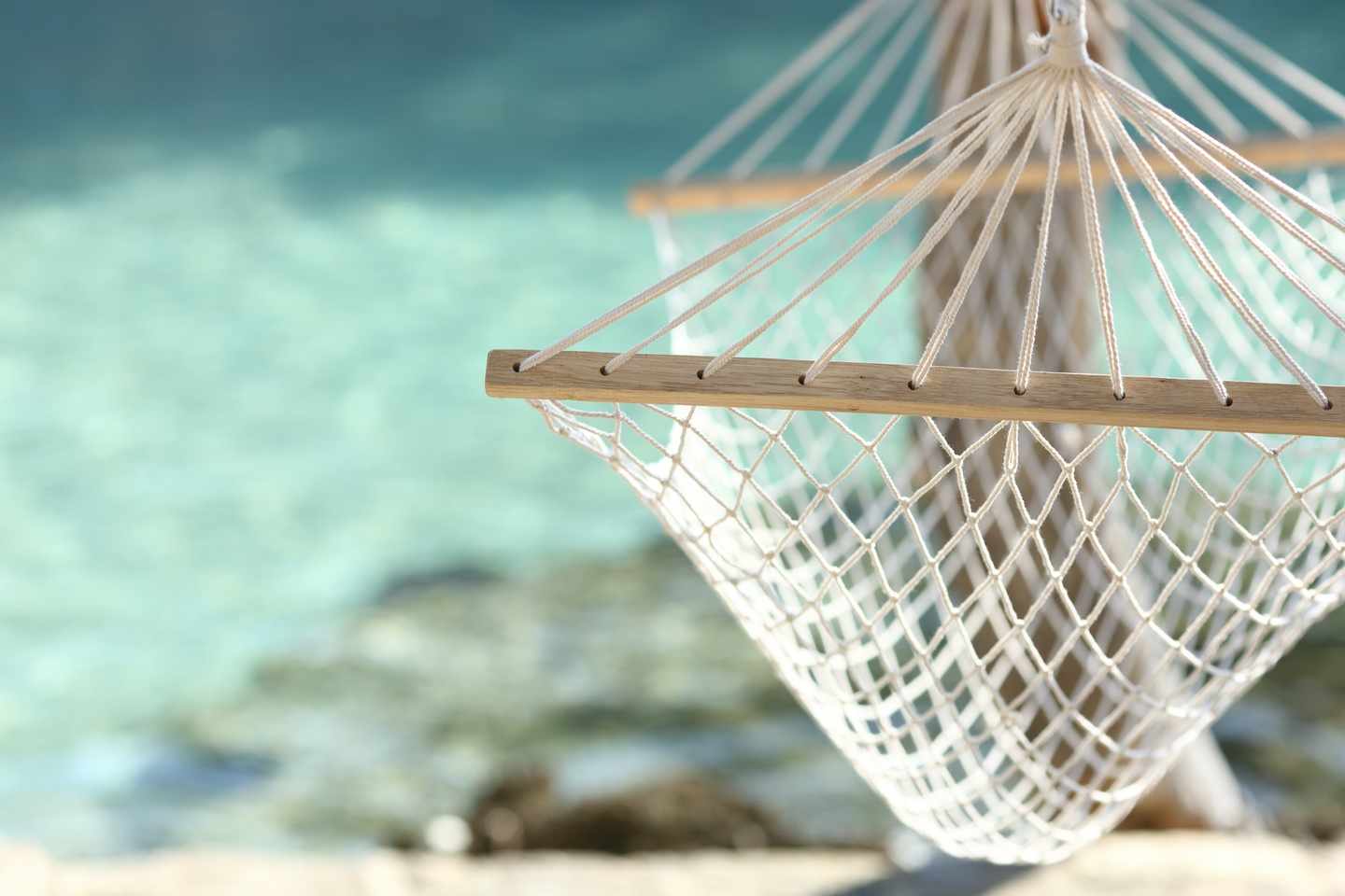 _KV_135937_Shutterstock_238446949_Travel-concept-with-a-hammock-in-a-tropical-beach-with-turquoise-water-in-the-background.jpg