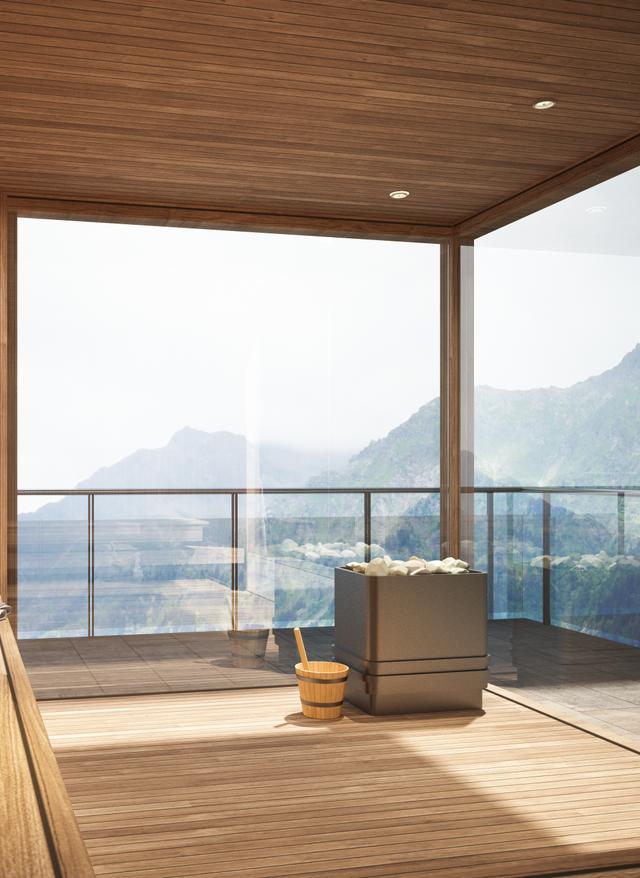 Saunaraum mit Holzbänken und großem Panoramafenster mit Blick auf Berglandschaft