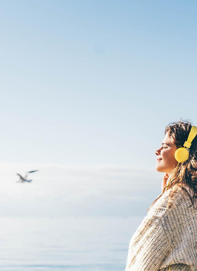 Jetzt anhören La Palma Spotify Musik Himmel Taube Frau mit Kopfhoerer